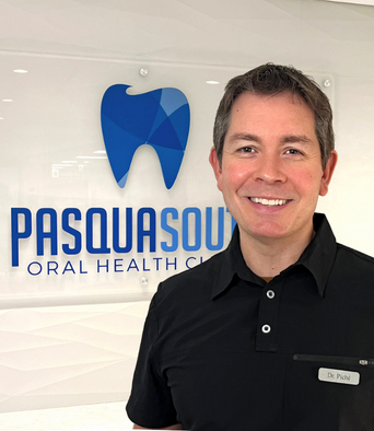 this is doctor piche posing in front of our dental office in Regina